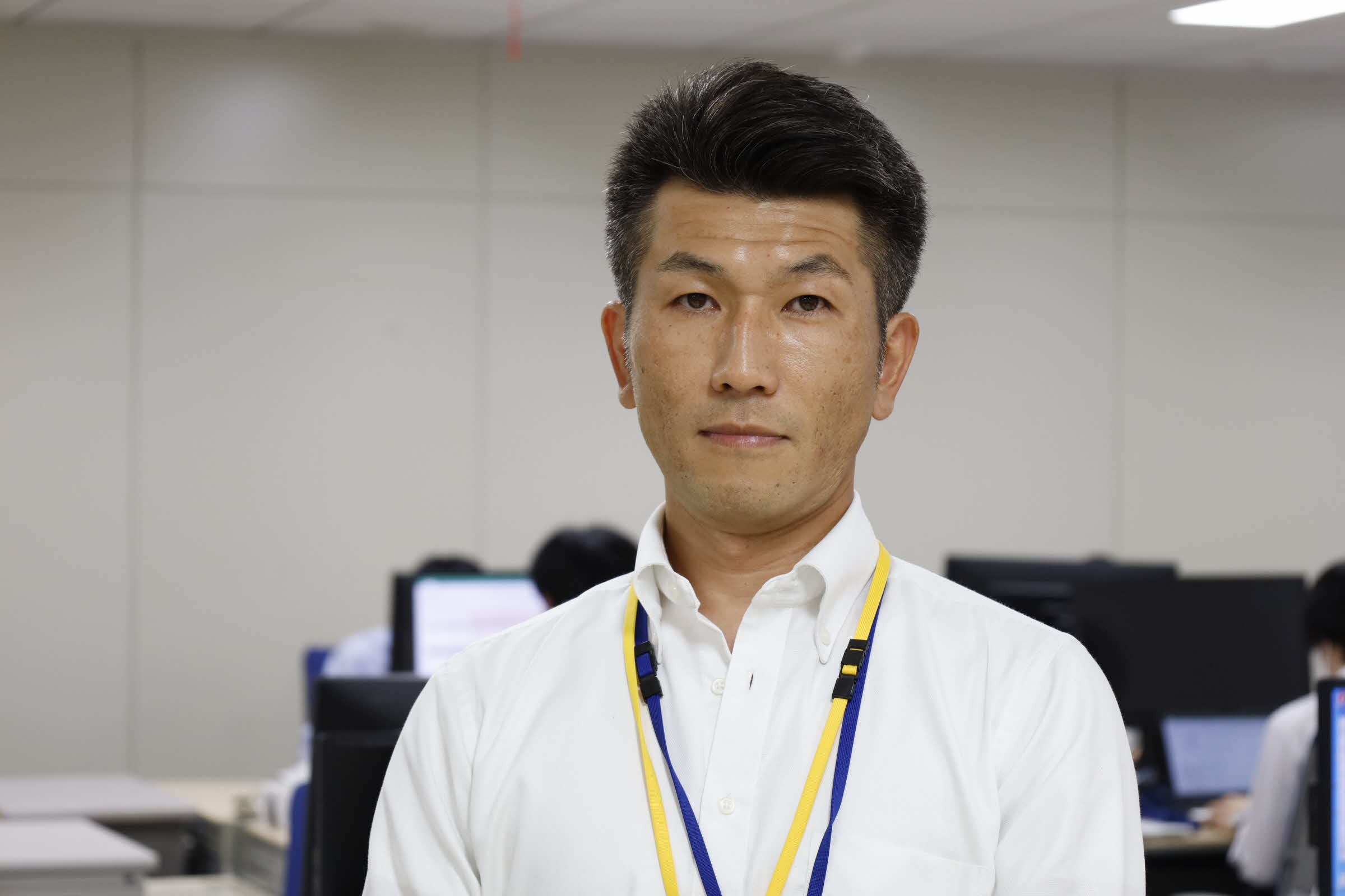 先輩職員 飯塚悦弘(いいづかよしひろ)の写真